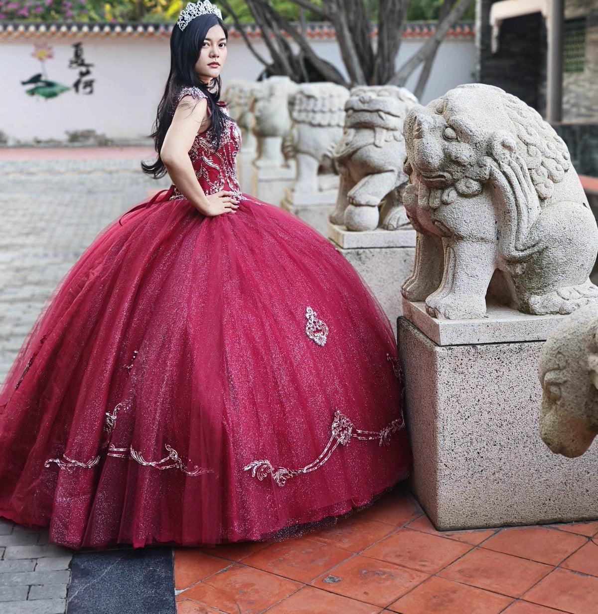 A beautiful gown, off-shoulder, reveals noble air.